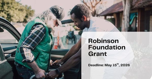 Image of a young man helping an older man with long hair out of a car with a walker. Text says "Robinson Foundation Grant"