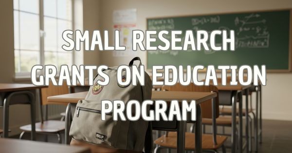 Image of backback on a school desk in a classroom with text that says "Small research grants on education"