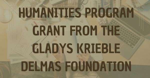 Image of a table with papers and a laptop with text that says "Humanities Program Grant from the Gladys Krieble Delmas Foundation"
