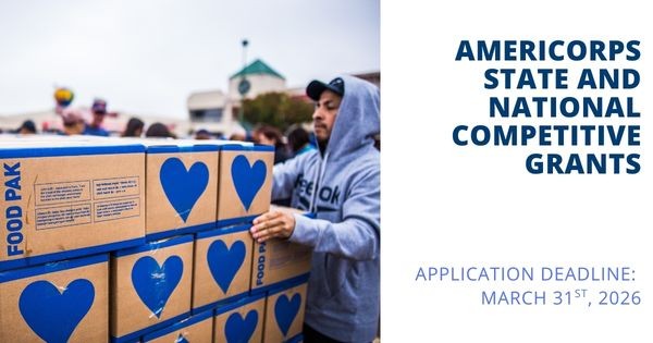 Image of man wearing a blue hoodie loading boxes. Text says "AmeriCorps State and National Competitive Grants"